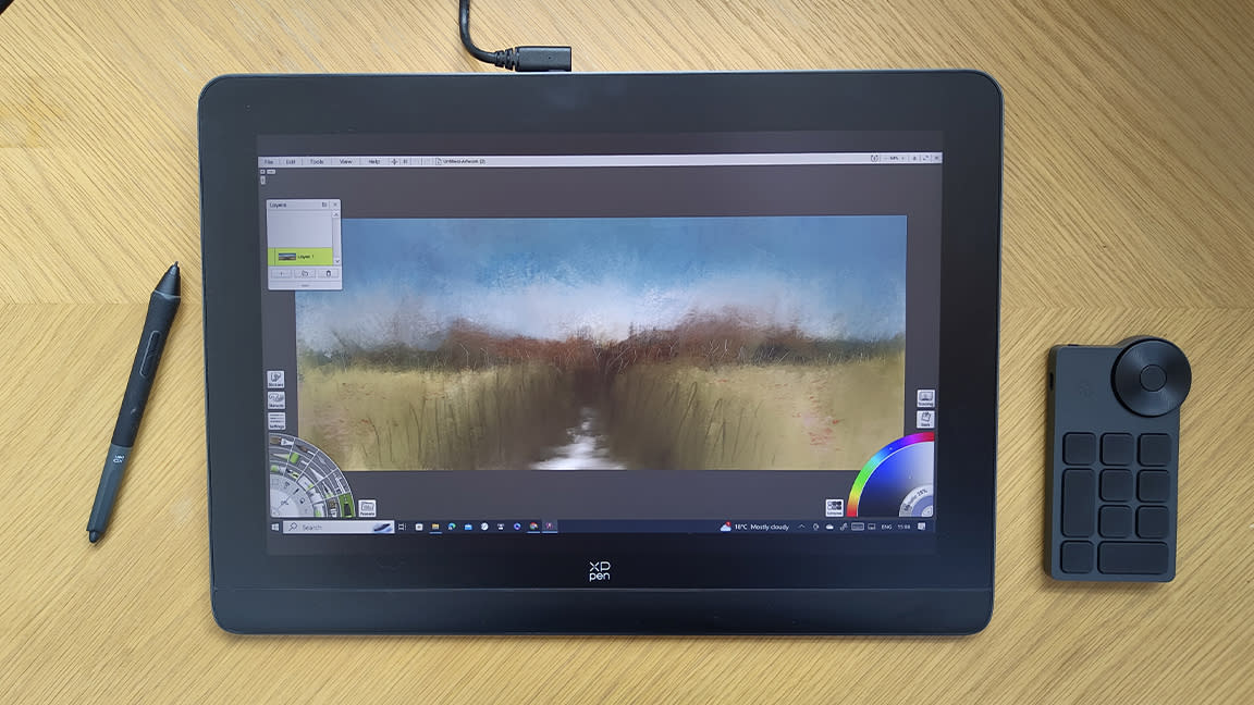  XPPen Artist Pro 16 (Gen 2) review; a graphics tablet on a wooden desk with accessories. 