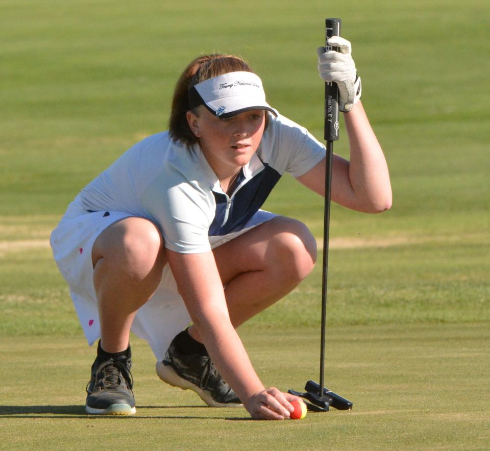 Clark-Willow Lake's Brynn Roehrich studies a putt on No. 1 Red during the Pre-Region 1B/Eastern Coteau Conference golf tournament at Cattail Crossing Golf Course. Roehrich captured girls division medalist honors in both tourneys with a 95.