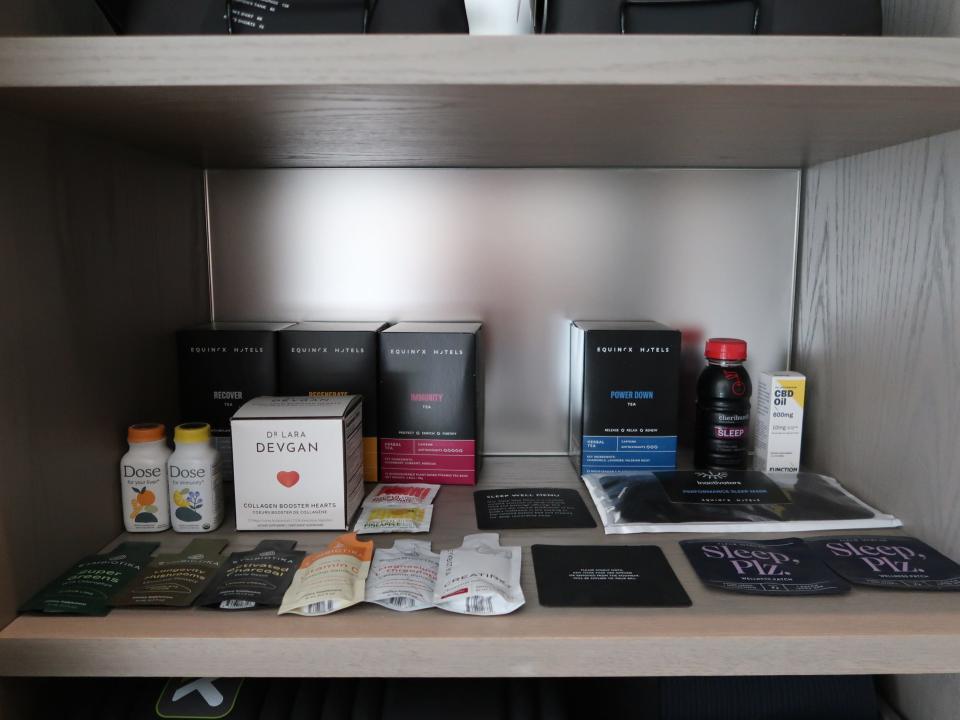 Health and wellness items in a cabinet in the Equinox Hotel.