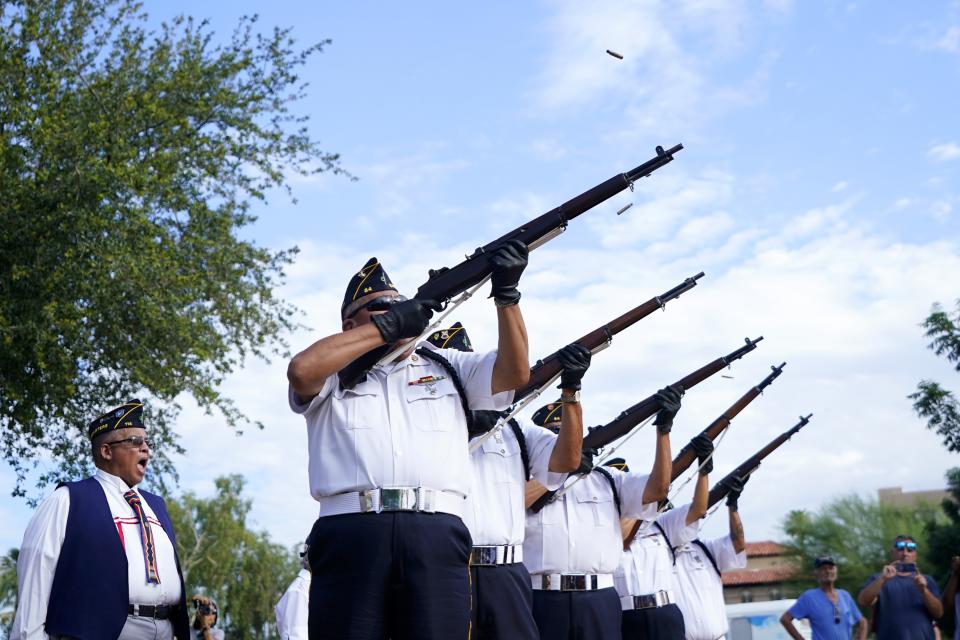 The Ira H. Hayes American Legion Post 84 Honor Guard performs the 21 rifle salute at the Arizona State Navajo Code Talkers Day ceremony, Sunday, Aug. 14, 2022, in Phoenix. (AP Photo/Ross D. Franklin)