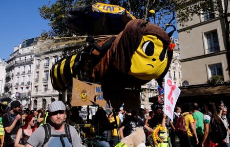 FILE PHOTO: People attend a protest urging authorities to take emergency measures against climate change, in Paris