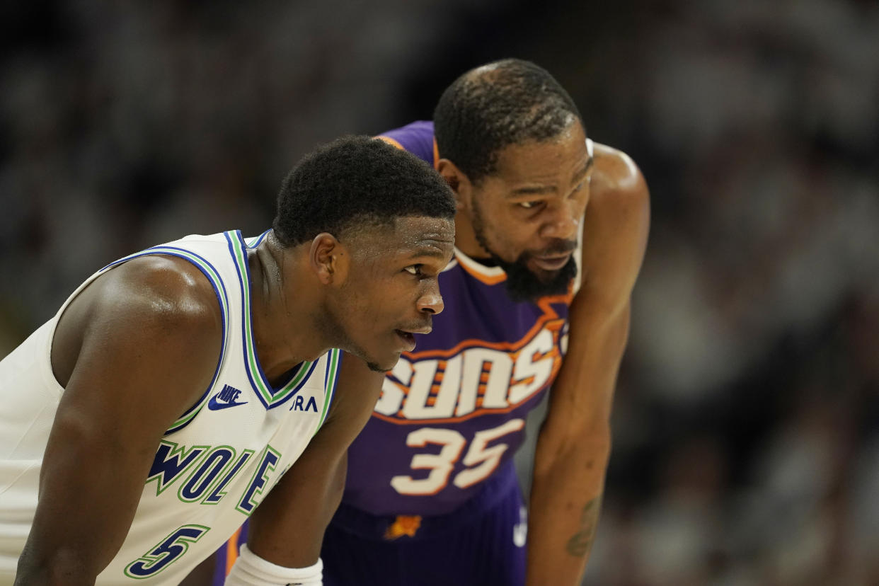 MINNEAPOLIS, MINNESOTA - APRIL 20: Anthony Edwards #5 of the Minnesota Timberwolves and Kevin Durant #35 of the Phoenix Suns talk during the second half in game one of the Western Conference First Round Playoffs at Target Center on April 20, 2024 in Minneapolis, Minnesota. NOTE TO USER: User expressly acknowledges and agrees that, by downloading and or using this photograph, User is consenting to the terms and conditions of the Getty Images License Agreement. (Photo by Patrick McDermott/Getty Images)