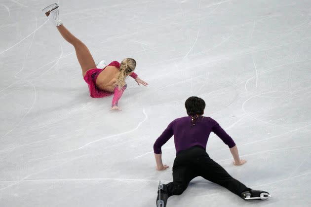 Kirsten Moore-Towers and Michael Marinaro, of Canada, fall in the pairs short program during the figure skating competition at the 2022 Winter Olympics. (Photo: via Associated Press)