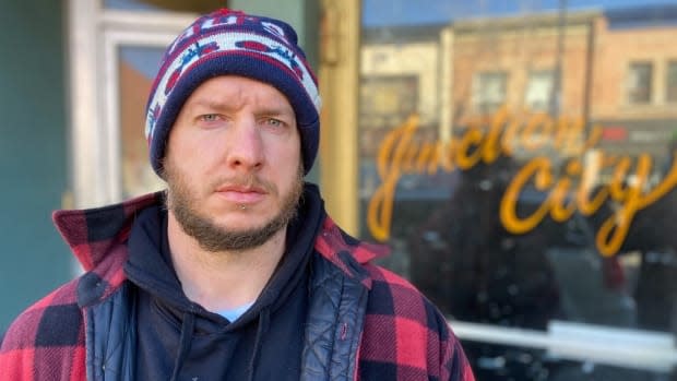 Ben Wilkinson stands in front of the live music venue, Junction City Music Hall, he and his brother opened in 2014. They are now in the process of losing the business due to COVID-19.