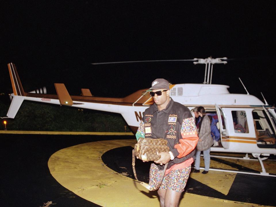 Deion Sanders arrives in Pittsburgh for an Atlanta Braves game after suiting up for the Atlanta Falcons in Miami earlier in the day.