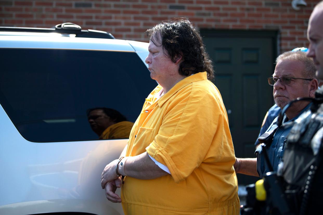 Defendant Robert Atkins is escorted to the police car after his preliminary hearing for the 1991 murder and arson of Joy Hibbs, 35, of Bristol Township on Wednesday, Sept. 21, 2022. 