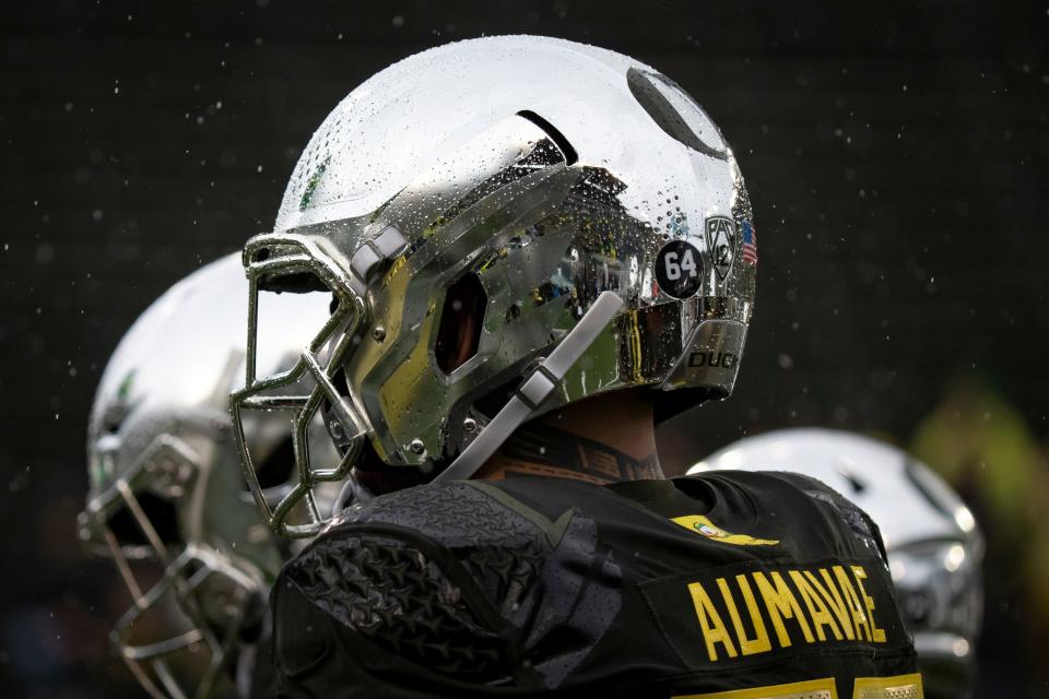 Autzen Stadium reflects through the rain drops on Oregon defensive tackle Popo Aumavae as the No. 6 Oregon Ducks host California Saturday, Nov. 4, 2023, at Autzen Stadium in Eugene, Ore.