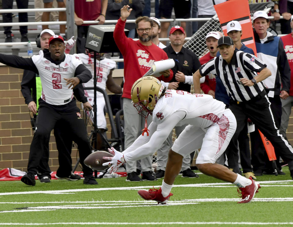 Boston College defensive back Khari Johnson picks up a Florida State fumble and runs to the endzone to score during the second half of an NCAA college football game Saturday, Sept. 16, 2023 in Boston. (AP Photo/Mark Stockwell)