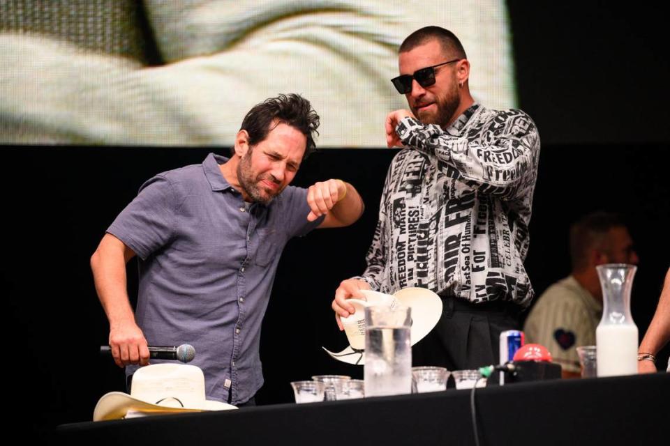 Big Slick host Paul Rudd, left, and Kansas City Chiefs tight end Travis Kelce can’t handle the heat of the spicy chicken wings they had to eat during a contest at the Big Slick party and show in June.