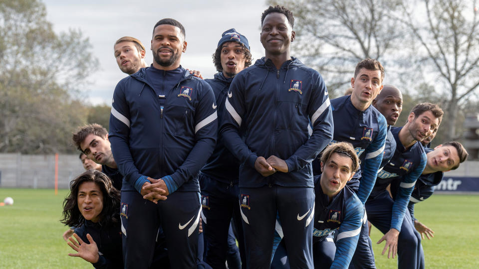 (L to R) Cristo Fernández as Dani Rojas, Stephen Manas as Richard Montlaur, David Elsendoorn as Jan Maas, Kola Bokinni as Isaac McAdoo, Moe Hashim as Bumbercatch, Toheeb Jimoh as Sam Obisanya, Phil Dunster as Jamie Tartt, Billy Harris as Colin Hughes and Moe Jeudy-Lamour as Thierry Zoreaux singing in formation in Ted Lasso season 3 episode 12, 