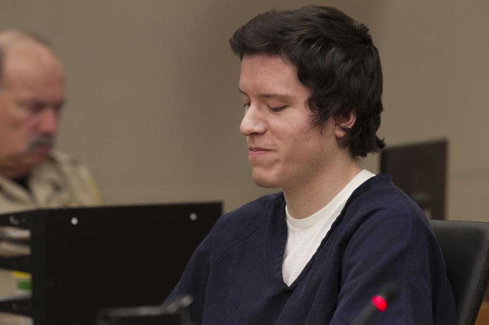 Defendant John Earnest grins during testimony by witness Oscar Stewart during Earnest's preliminary hearing, Thursday, Sept. 19, 2019, in Superior Court in San Diego. Prosecutors say Earnest opened fire during a Passover service at the Chabad of Poway synagogue on April 27, killing one woman and injuring three people, including the rabbi. (John Gibbins/The San Diego Union-Tribune via AP, Pool)