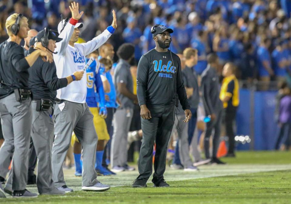 DeShaun Foster stands on the sideline during a game in October 2018.