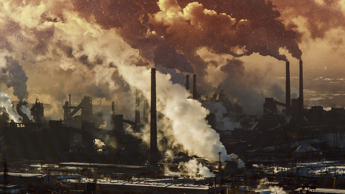 A composite picture of industrial plants belching smoke.