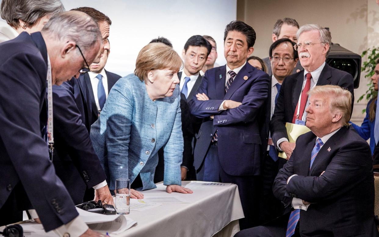 Angela Merkel berating Donald Trump at the 2018 G7 summit in Canada.  - REUTERS