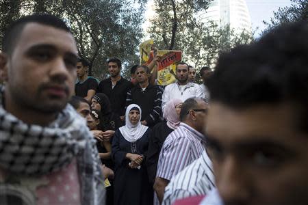 Residents of Shfaram, an Israeli Arab town, gather to show their support for defendants in a trail, outside a district court in the northern city of Haifa November 28, 2013. REUTERS/Nir Elias