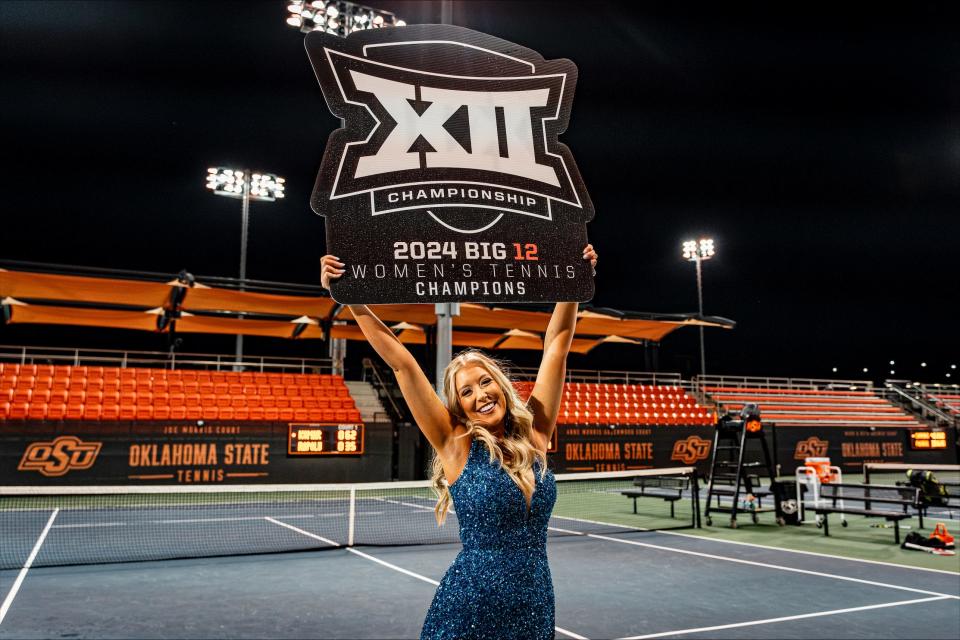 Kelsy Young, the daughter of Oklahoma State tennis coach Chris Young, celebrates the Cowgirls' Big 12 Tournament championship in her prom dress before going to the dance.