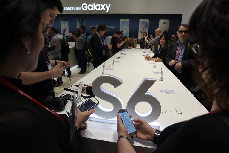 Visitors test Samsung Galaxy S6 smartphones during the opening day of the Mobile World Congress (MWC) in Barcelona, on March 2, 2015