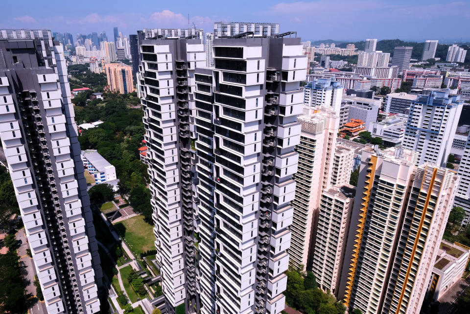 A stylish HDB skyscraper with lush landscaping and roof top gardens, to illustrate the story of rising prices for HDB resale flats in Singapore.