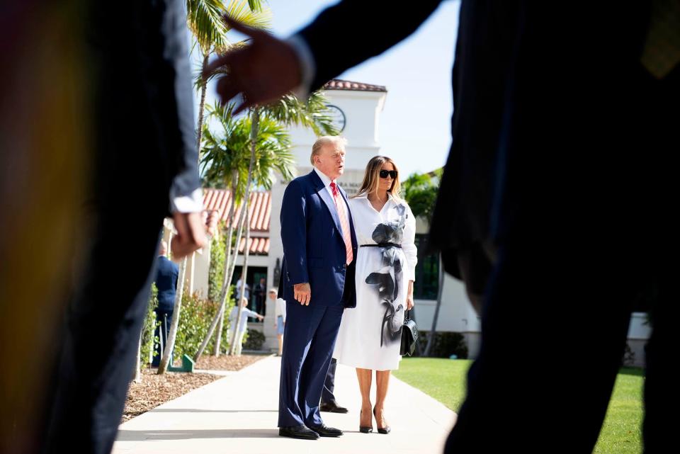 Donald and Melania Trump stand in front of members of the media after casting their votes at the Morton and Barbara Mandel Recreation Center on elections day March 19, 2024 Palm Beach.