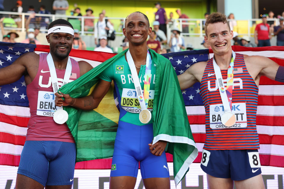 (From left) Silver medalist Rai Benjamin of Team USA, gold medalist Alison dos Santos of Team Brazil and bronze medalist Trevor Bassitt of the U.S. celebrate after competing in the men's 400 meter hurdles at the World Athletics Championships on July 19, 2022 in Eugene, Oregon. (Patrick Smith/Getty Images)