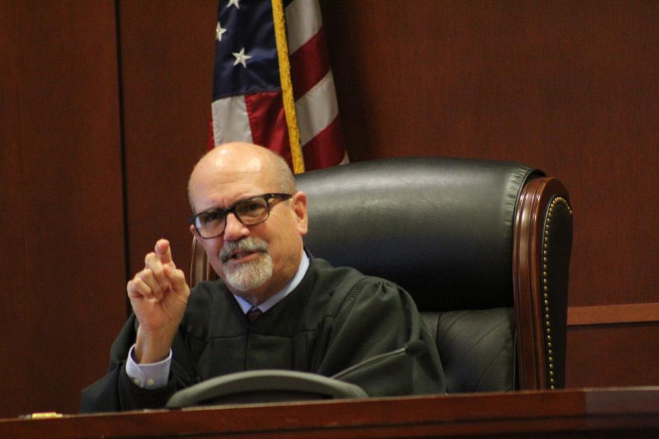 Circuit Judge James Clayton speaks to attorneys on Friday during the trial of Marcus Pinckney, who is accused of killing one man and trying to kill two others.