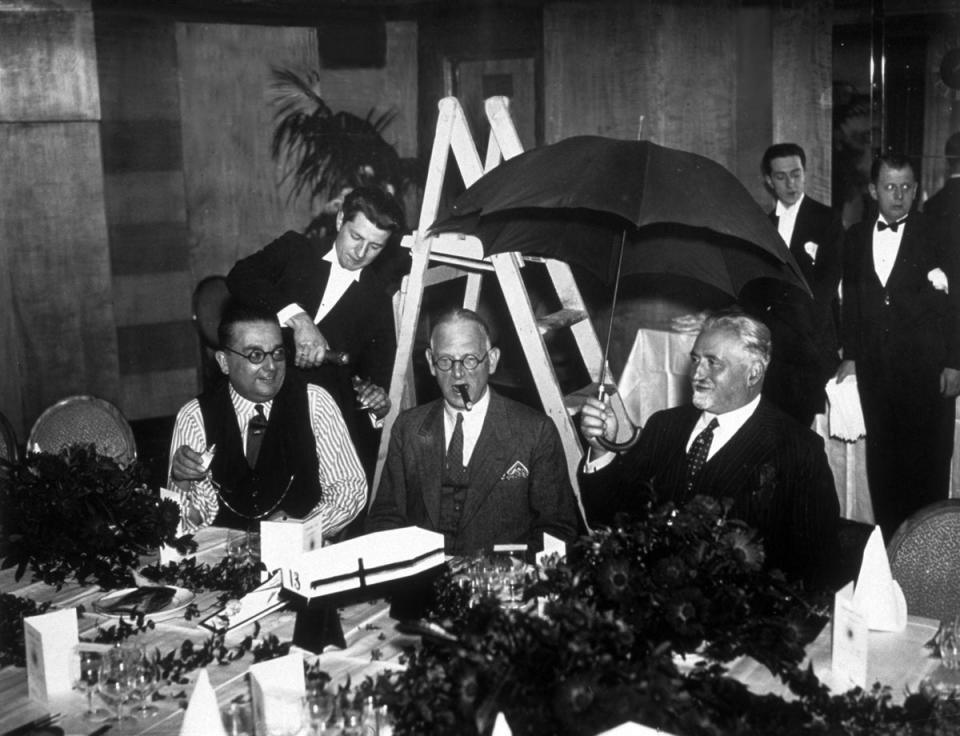 Members of the Eccentric Club of London, at their annual Friday the Thirteenth lunch, surrounded by omens of bad luck (E Dean / Topical Press Agency / Getty Imagges)