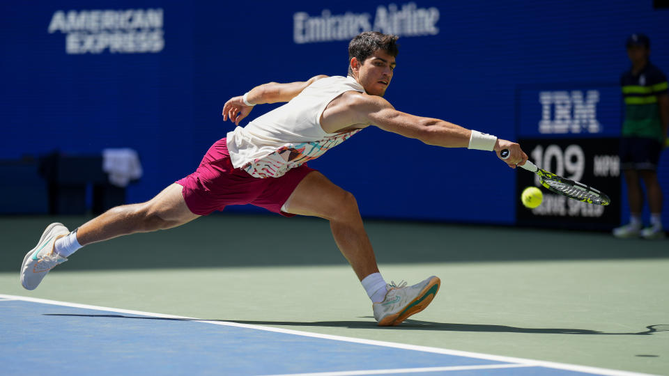 Carlos Alcaraz, of Spain, returns a shot to Daniel Evans, of the United Kingdom, during the third round of the U.S. Open tennis championships, Saturday, Sept. 2, 2023, in New York. (AP Photo/Manu Fernandez)