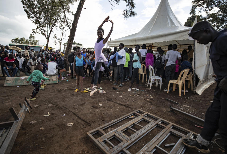 A young dancer performs in a Christmas ballet event in Kibera, one of the busiest neighborhoods of Kenya's capital, Nairobi, Friday, Dec. 15, 2023. The ballet project is run by Project Elimu, a community-driven nonprofit that offers after-school arts education and a safe space to children in Kibera. (AP Photo/Brian Inganga)