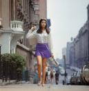 <p>A fashionable young women walks uptown in New York City. </p>