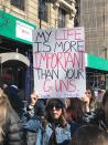 <p>One young woman holds up her sign. (Photo: Laura Kenney for Yahoo Lifestyle) </p>