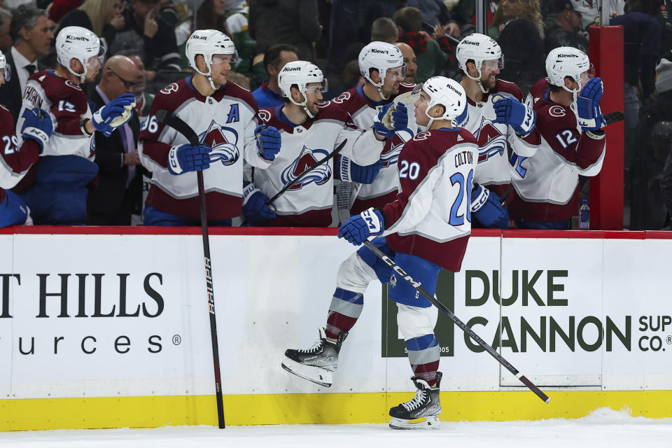 Colorado Avalanche center Ross Colton is congratulated for his against the Minnesota Wild during the first period of an NHL hockey game Friday, Nov. 24, 2023, in St. Paul, Minn. (AP Photo/Matt Krohn)