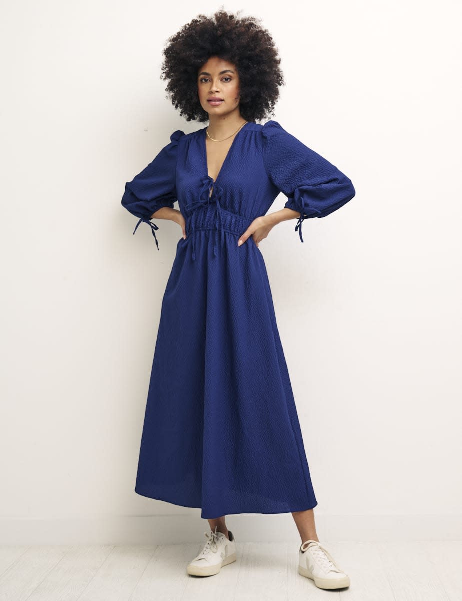 We love this cobalt blue dress with a soft, flowing shape and cute drawstring details. (Nobody's Child)