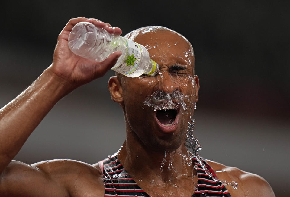 Damian Warner, of Canada douses himself in water as he celebrates after winning the gold medal in the decathlon at the 2020 Summer Olympics, Thursday, Aug. 5, 2021, in Tokyo, Japan. (AP Photo/Francisco Seco)