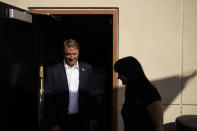 Former U.S. Sen. Dean Heller, left, tours Share Village Las Vegas with co-owner Shannon Kelly, right, after announcing a bid for governor of Nevada, Monday, Sept. 20, 2021, in Las Vegas. (AP Photo/John Locher)