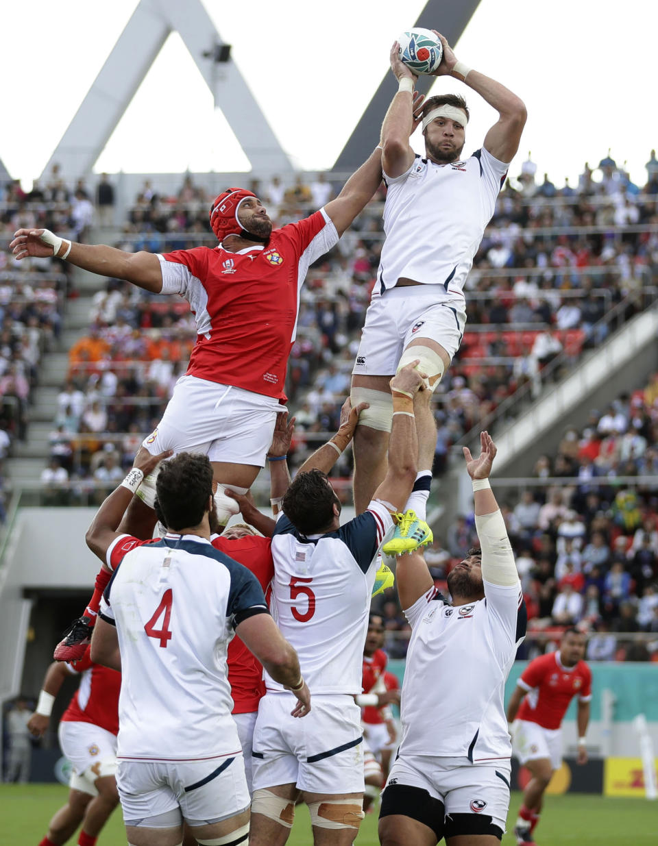 United States' Cam Dolan wins the lineout ball during the Rugby World Cup Pool C game at Hanazono Rugby Stadium between USA and Tonga in Osaka, Japan, Sunday, Oct. 13, 2019. (Kyodo News via AP)