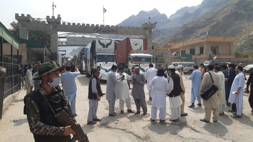 Taliban and Pakistani security keep guard at Torkham border crossing as Afghans wait for the reopening of the border gate to enter Pakistan (Anadolu Agency via Getty Images)