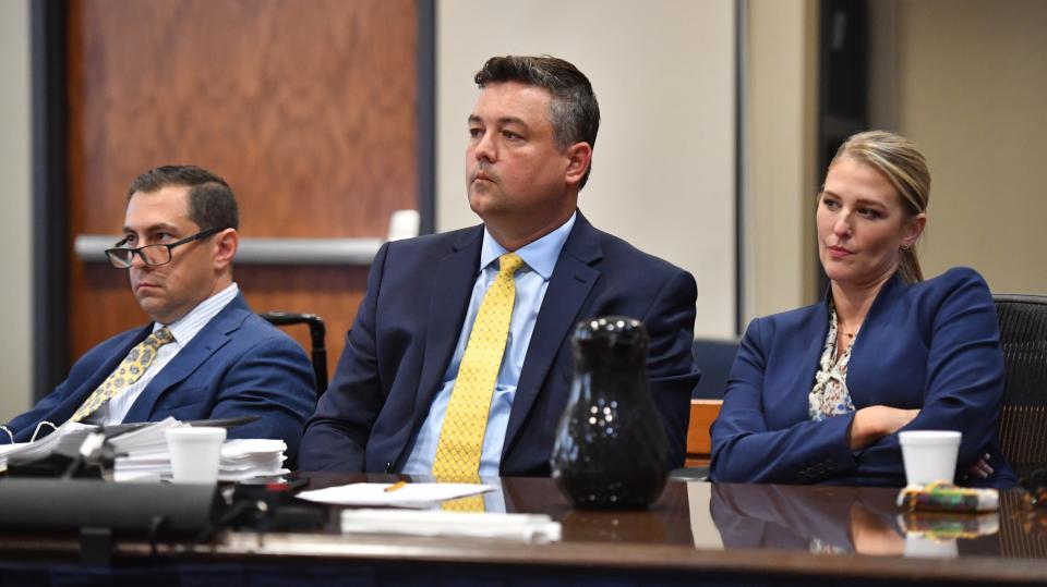 Christian and Bridget Ziegler sit with their attorney, Matthew Sarelson, left, during a hearing Thursday, May 16, 2024 before Judge Hunter Carroll in Sarasota. The Zieglers filed suit against the City of Sarasota, Sarasota Police Department and the 12th Judicial Circuit State Attorney's Office to stop the release of records obtained during closed criminal investigations into video voyeurism and sexual battery by Christian Ziegler. Ziegler was not charged in either case.
