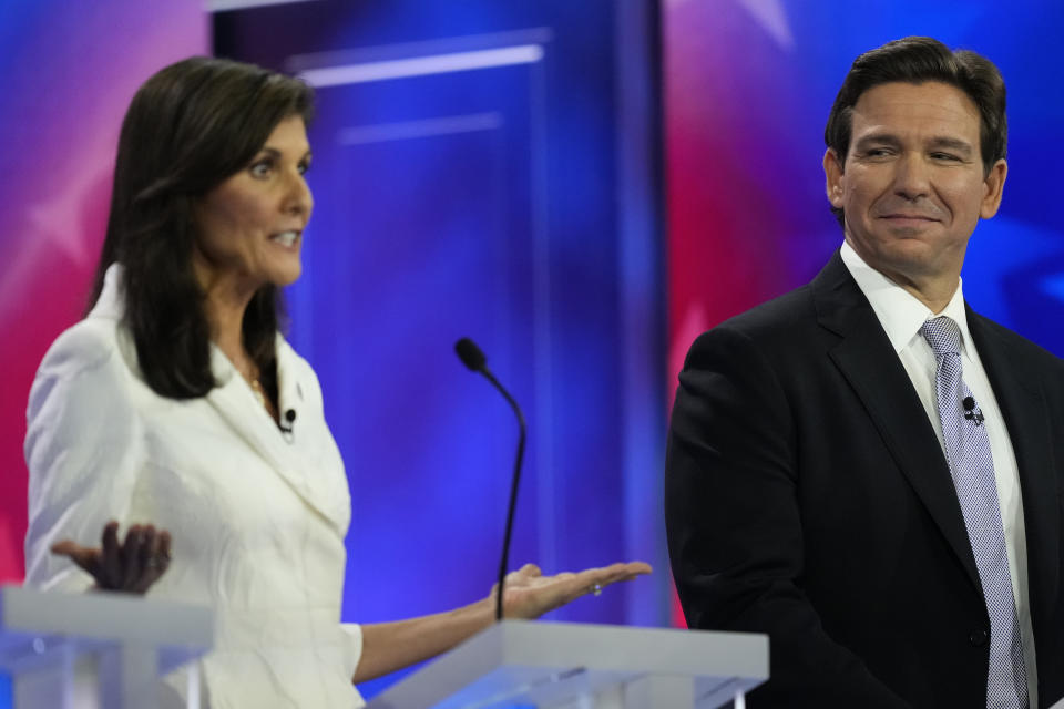 Republican presidential candidate former U.N. Ambassador Nikki Haley speaks as Florida Gov. Ron DeSantis listens during a Republican presidential primary debate hosted by NBC News, Wednesday, Nov. 8, 2023, at the Adrienne Arsht Center for the Performing Arts of Miami-Dade County in Miami. (AP Photo/Rebecca Blackwell)