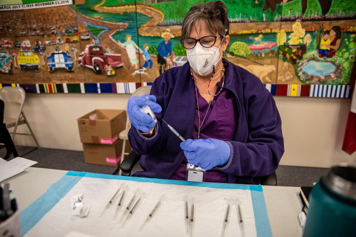 A nurse fills up a syringe with the Moderna COVID-19 vaccine at a vaccination site at a senior center on March 29, 2021, in San Antonio, Texas.