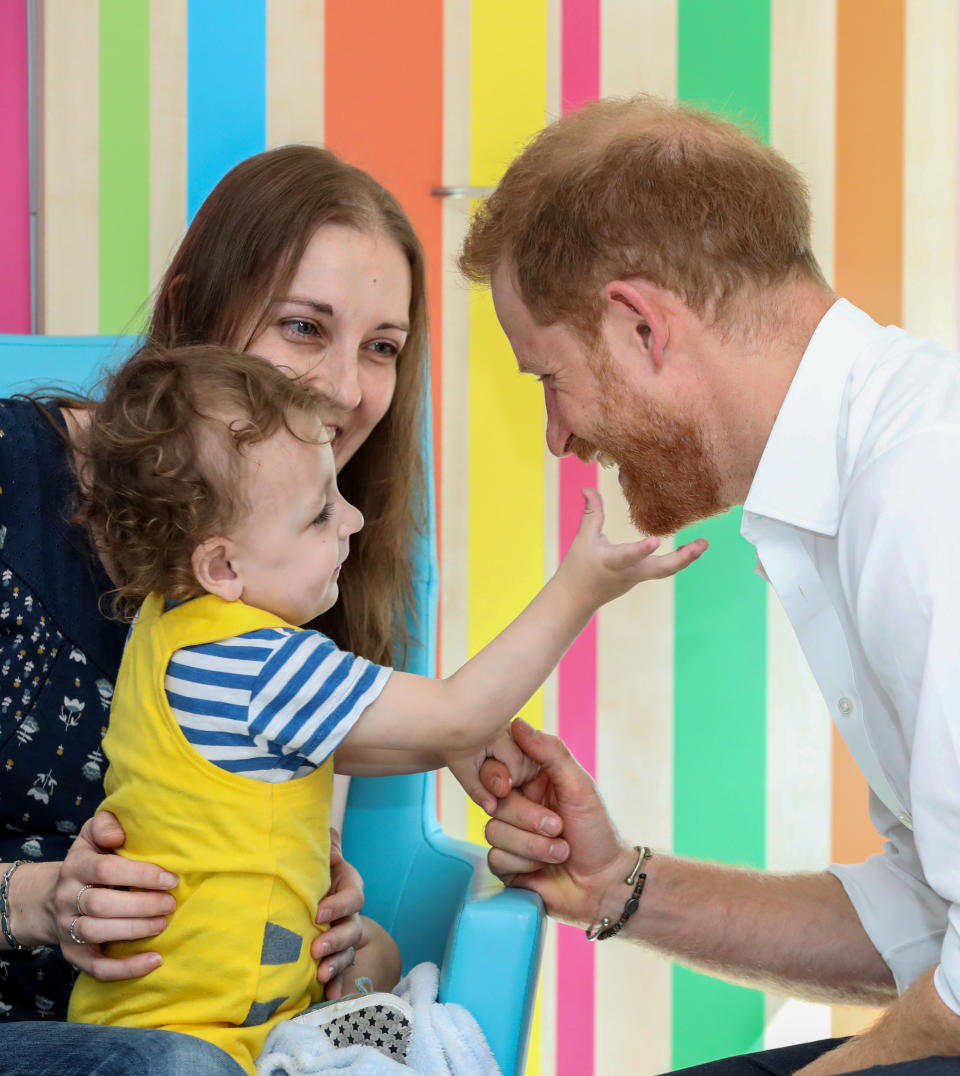 The Duke of Sussex plays with one year old Noah Nicholson during his visit to Sheffield Children's Hospital in Clarkson Street, Sheffield, where he officially opened the new wing.