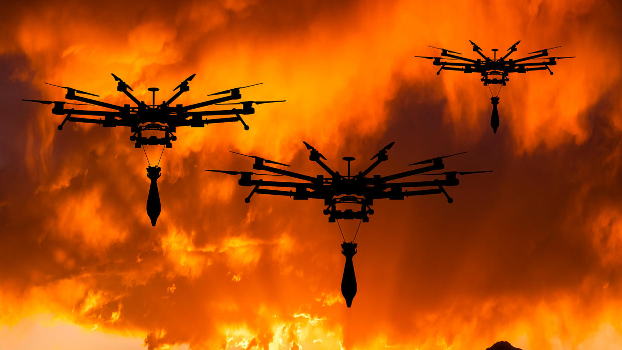  Military drone with a bomb at sunset. Attack drone in military conflicts. 