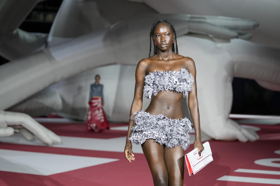 A model wears a creation as part of the Diesel women's Spring Summer 2023 collection presented in Milan, Italy, Wednesday, Sept. 21, 2022. (AP Photo/Antonio Calanni)