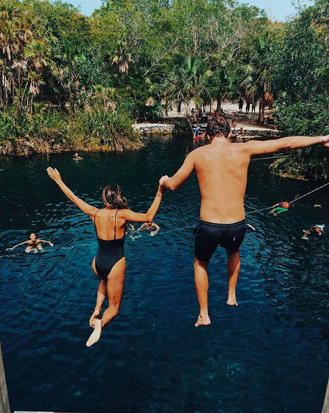 <p>The pair have over 366,000 Instagram followers between them. In this shot they're seen jumping in the water in Mexico.</p>