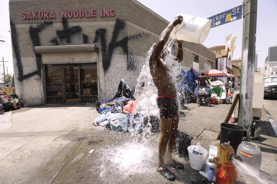 A man douses himself with water