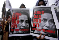 <p>Muslim women hold posters of Myanmar’s State Counsellor Aung San Suu Kyi during a rally against the persecution of Rohingya Muslims in Medan, North Sumatra, Indonesia, Wednesday, Sept. 6, 2017. (Photo: Binsar Bakkara/AP) </p>