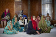 Britain's opposition Liberal Democrats party leader Jo Swinson, centre, during a visit to the Gurdwara Singh Sabha Temple for an election campaign stop in Glasgow, Scotland, Thursday Nov. 14, 2019. Britain's Brexit is one of the main issues for voters and political parties as the UK goes to the polls in a General Election on Dec. 12. (Jane Barlow/PA via AP)