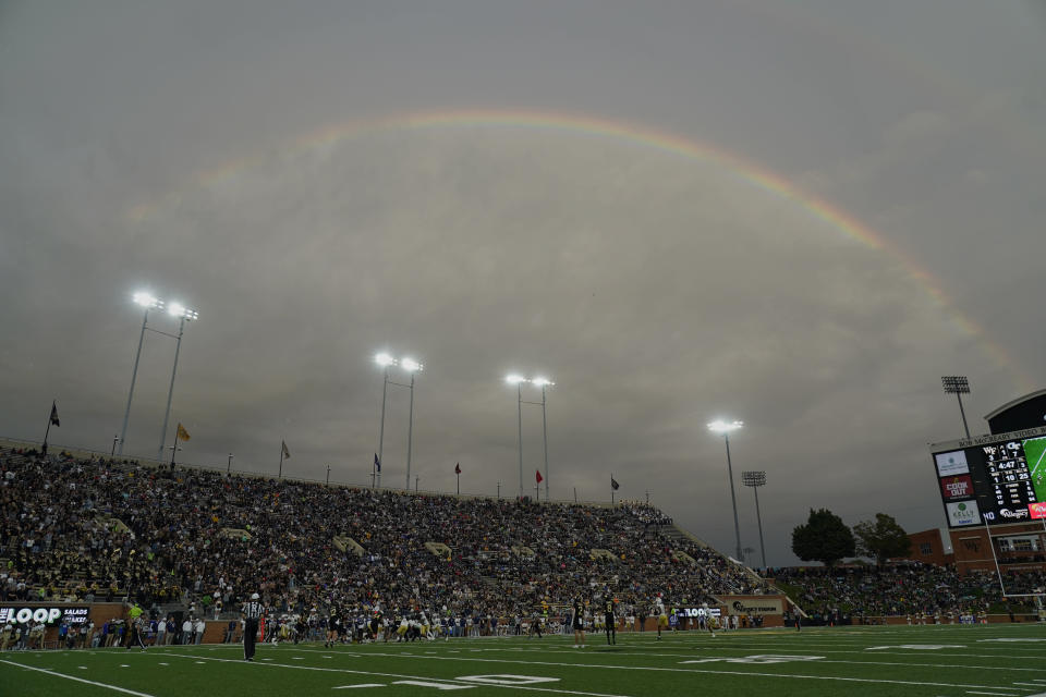 A rainbow appears during the first half of an NCAA college football game between Wake Forest and Georgia Tech in Winston-Salem, N.C., Saturday, Sept. 23, 2023. (AP Photo/Chuck Burton)