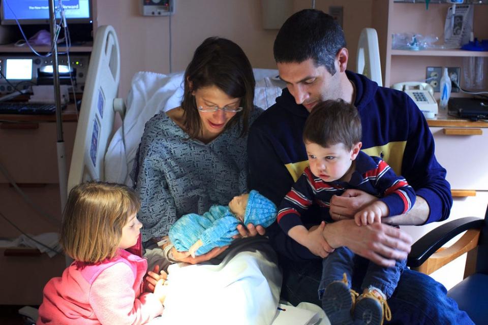 Monica Canetta with her husband, Carlo Canetta, and children at Matteo's birth in 2015 in Boston.