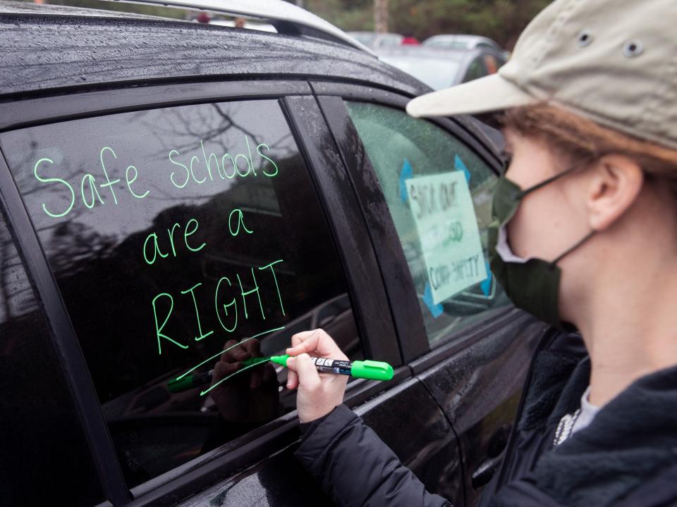 Garfield Elementary kindergarten teacher Katya Meltaus decorates her car before a teacher protest outside Oakland school district in January 2022.