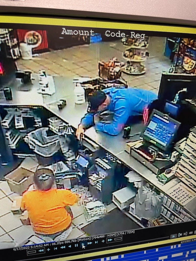 Surveillance video shows a man reportedly holding a Circle K store clerk at gunpoint during a robbery in Miramar Beach on Friday morning. The suspect was injured in a shoot out with law enforcement Saturday morning after he allegedly led deputies on a pursuit spanning more than 65 miles.